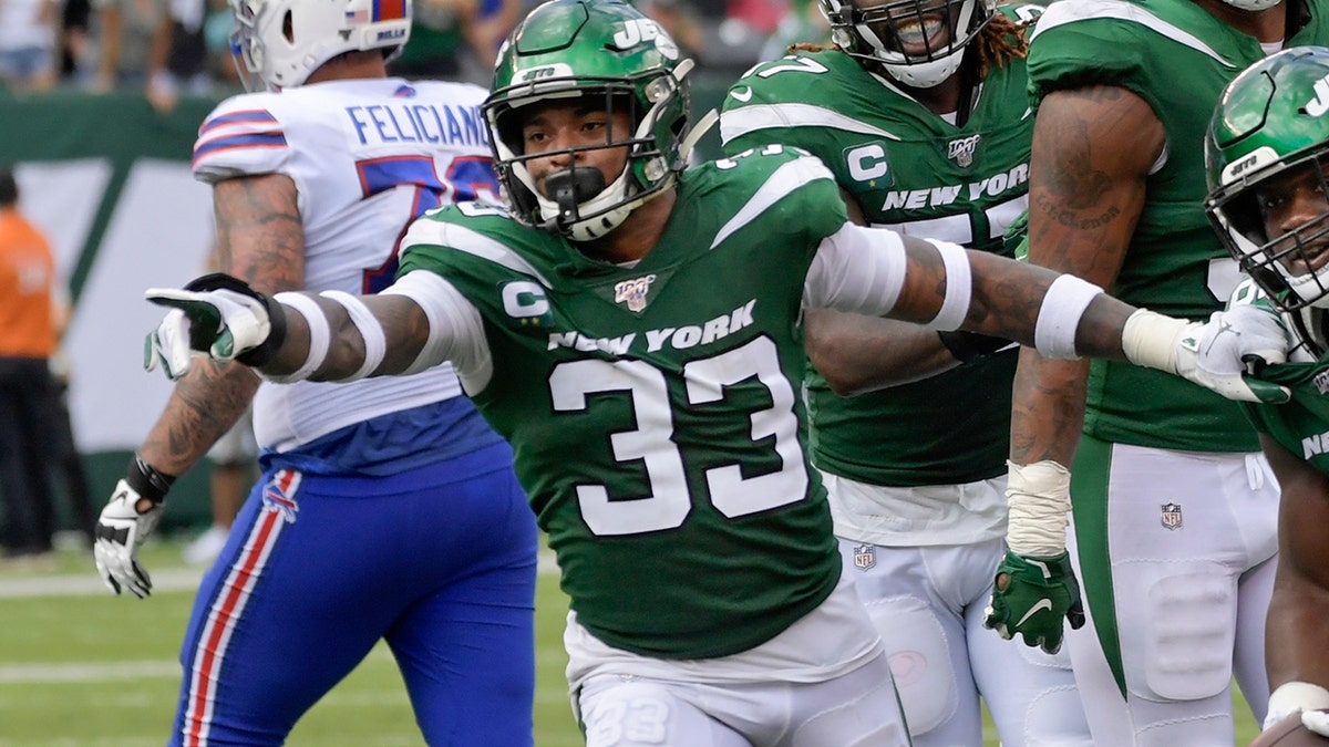 New York Jets' Neville Hewitt (46) and Jamal Adams (33) celebrate with teammates after Neville Hewitt intercepted a pass during the first half of an NFL football game against the Buffalo Bills Sunday, Sept. 8, 2019, in East Rutherford, N.J. (AP Photo/Bill Kostroun)