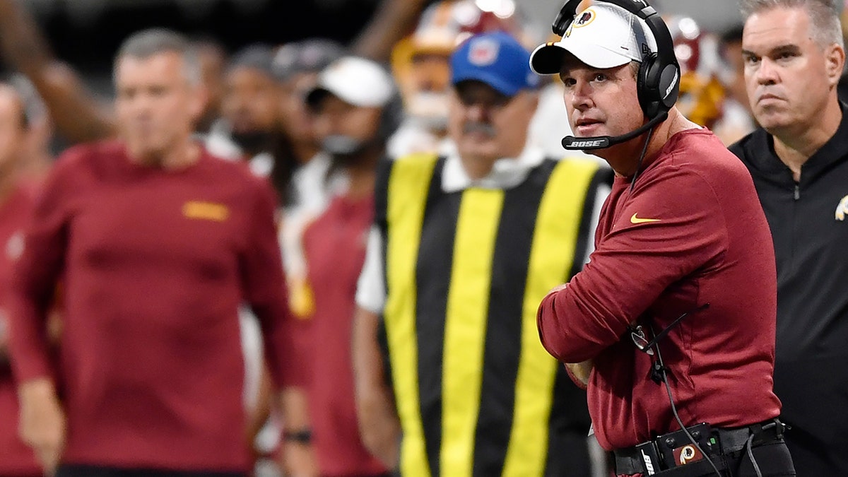Washington Redskins head coach Jay Gruden watches play against the Atlanta Falcons during the first half of an NFL preseason football game, Thursday, Aug. 22, 2019, in Atlanta. (AP Photo/Mike Stewart)