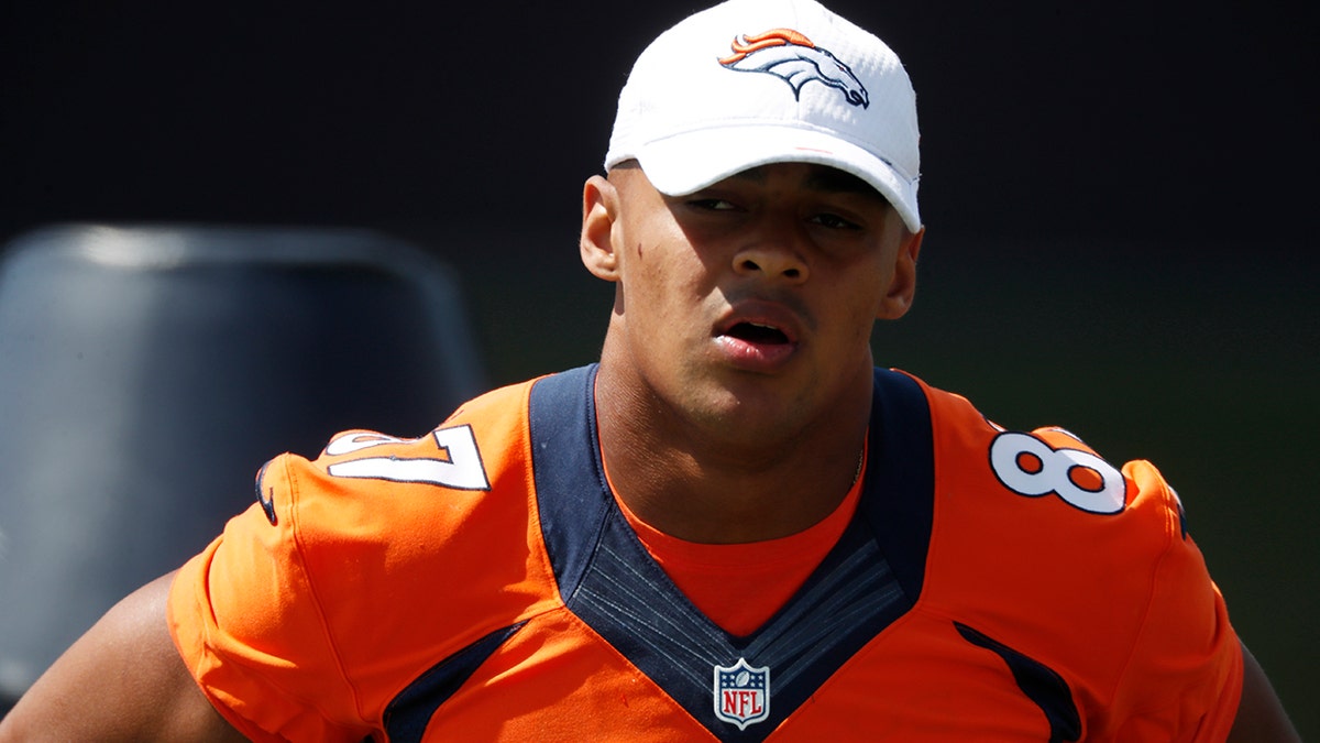 Denver Broncos rookie tight end Noah Fant looks on as players take part in an NFL football practice Tuesday, Aug. 27, 2019, at the team's headquarters in Englewood, Colo. (AP Photo/David Zalubowski)