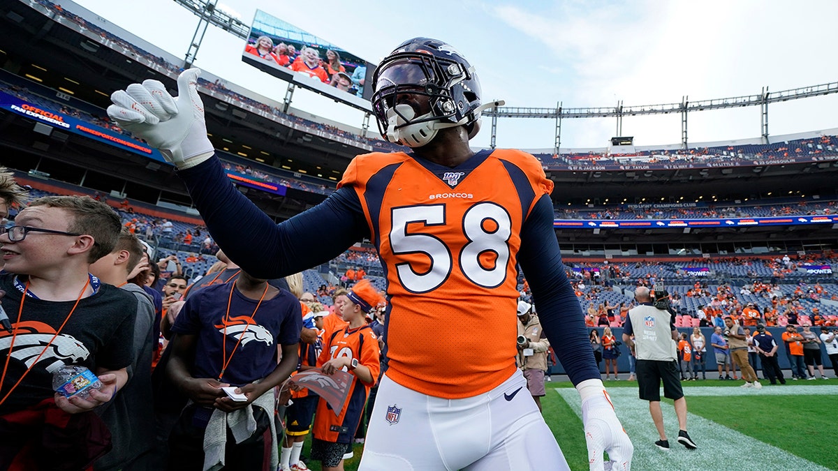 Denver Broncos outside linebacker Von Miller (58) gives a thumbs up tp fans prior to an NFL preseason football game against the Arizona Cardinals, Thursday, Aug. 29, 2019, in Denver. (AP Photo/Jack Dempsey)