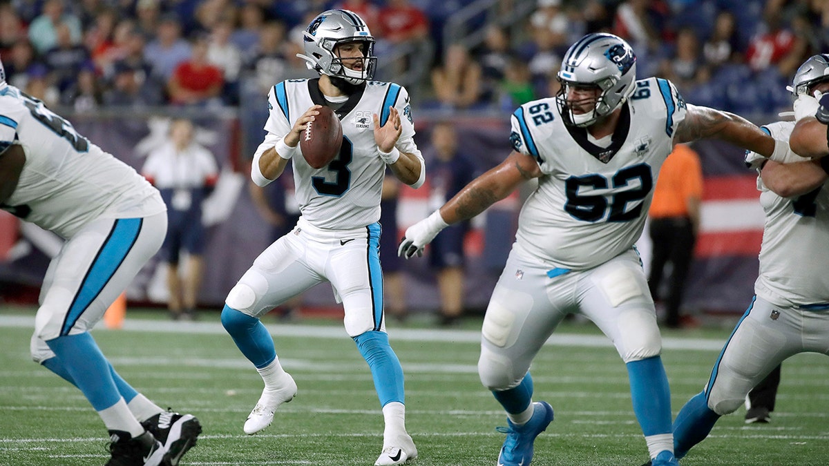 Carolina Panthers quarterback Will Grier (3) drops back to pass against the New England Patriots in the second half of an NFL preseason football game on Aug. 22, 2019, in Foxborough, Mass. (AP Photo/Elise Amendola)