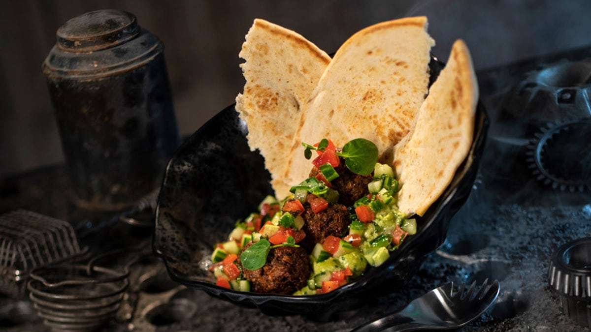 The Felucian Garden Spread, to be available at the Docking Bay 7 Food &amp; Cargo in Galaxy's Edge, comes with a plant-based kefta patty, hummus, salad and pita.