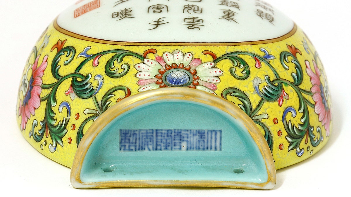 The 8ins Qianlong famille rose vase, found in Hertfordshire, was made around 300 years ago in China and was marked with a symbol that meant it wasn't for export, but for the Emperor's palace. (Credit: Sworders, BNPS)