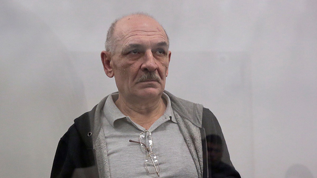 Volodymyr Tsemakh, suspected of involvement in the downing of the Malaysia Airlines flight MH17 plane in 2014, stands inside a defendants' cage during a court hearing in Kiev, Ukraine September 5, 2019.