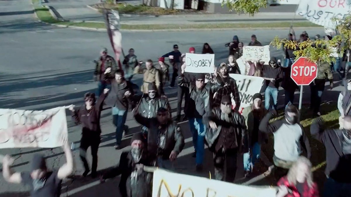 A still from the upcoming movie "The Reliant" featuring protesters rioting in a small U.S. town.