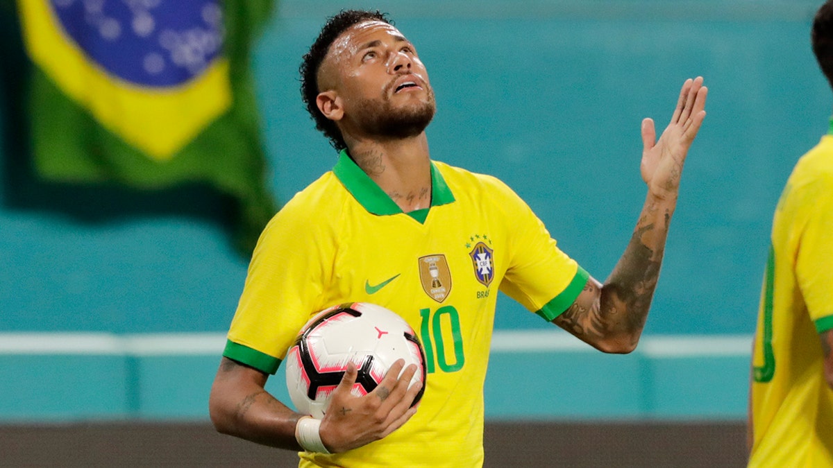 Brazil forward Neymar reacts after scoring a goal during the second half of a friendly soccer match against Colombia, Friday, Sept. 6, 2019, in Miami Gardens, Fla. (AP Photo/Lynne Sladky)