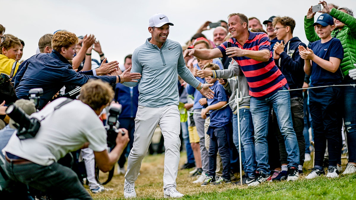 England's Pauls Casey celebrates after winning the European Open golf tournament, in Hamburg, Germany, Sunday Sept. 8, 2019. (Axel Heimken/dpa via AP)