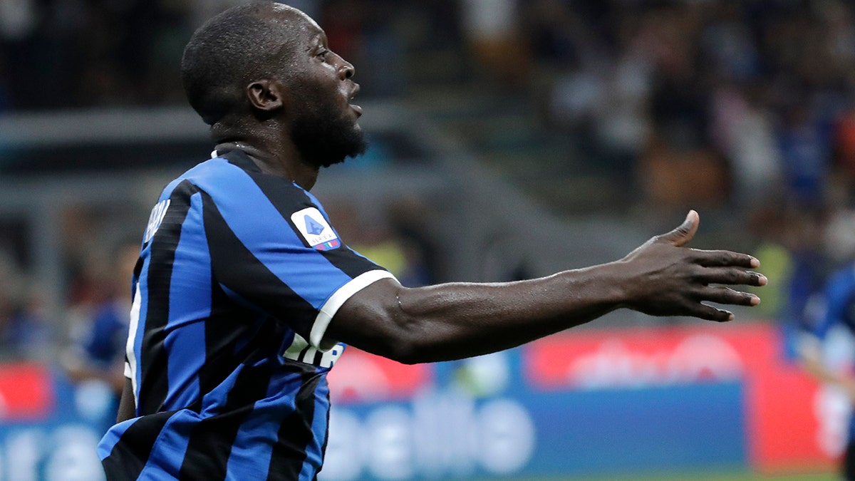 Inter Milan's Romelu Lukaku celebrates after scoring his side's third goal during the Serie A soccer match between Inter Milan and Lecce at the San Siro stadium, in Milan, Italy, Monday, Aug. 26, 2019. (AP Photo/Luca Bruno)