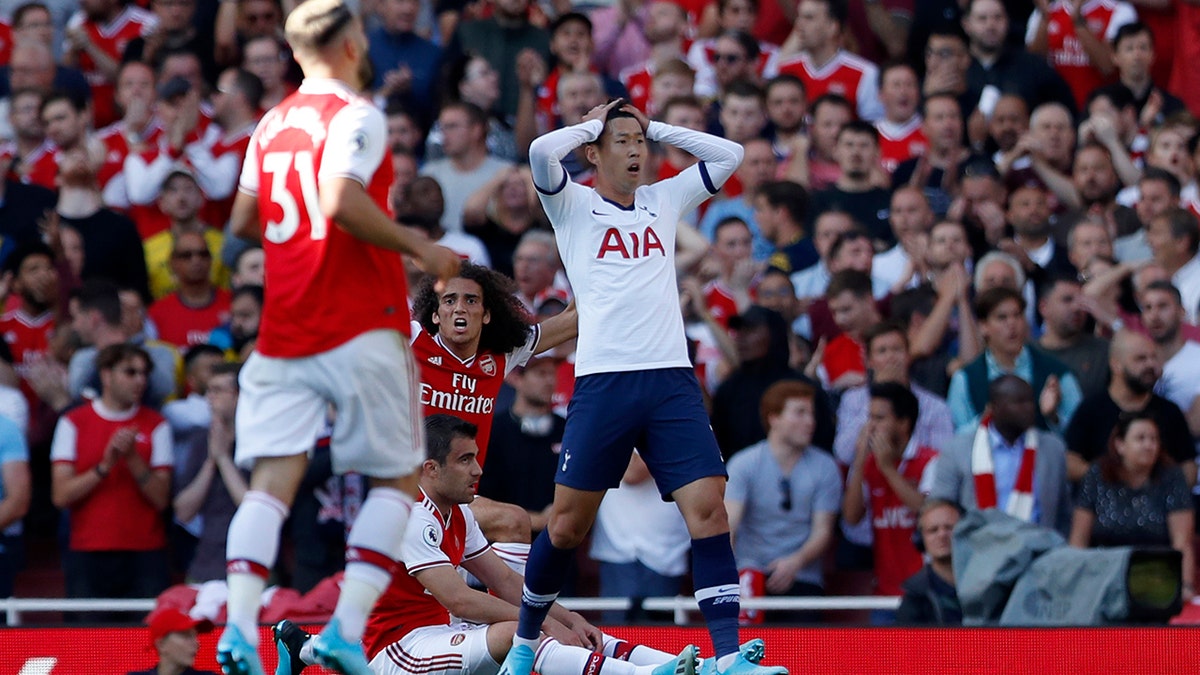 Tottenham's Son Heung-min reacts after missing a chance to score during their English Premier League soccer match between Arsenal and Tottenham Hotspur at the Emirates stadium in London, Sunday, Sept. 1, 2019. (AP Photo/Alastair Grant)