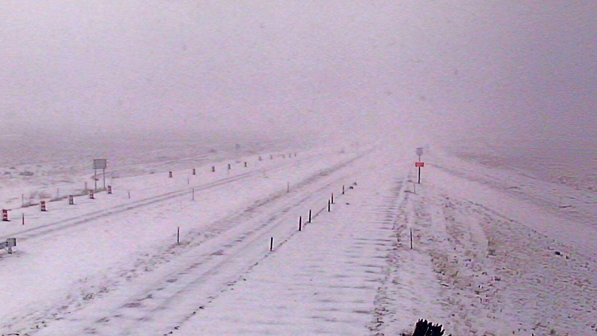 Whiteout conditions can be seen on Interstate 15 near Sieben, Mont. on Sunday as an early-season winter storm impacts the region.