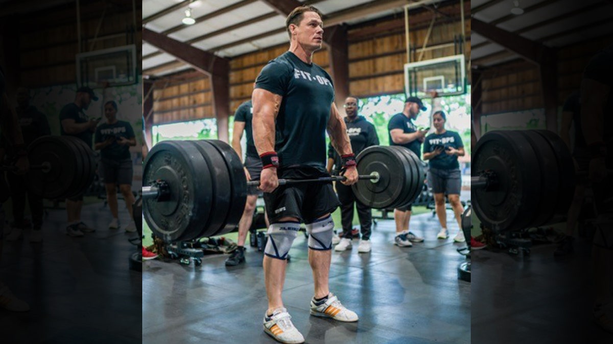 This summer, WWE star John Cena explained that happiness for a man isn’t always about the machismo element associated with being an “alpha-male,” but the connection he may have to a group of people with a common goal. (FitOps Foundation)
