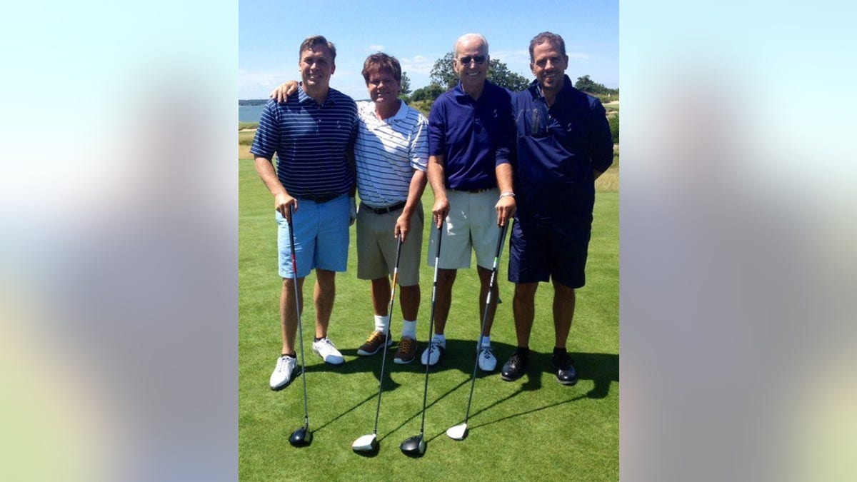 Devon Archer, far left, with former Vice President Joe Biden and his son Hunter, far right, in 2014.