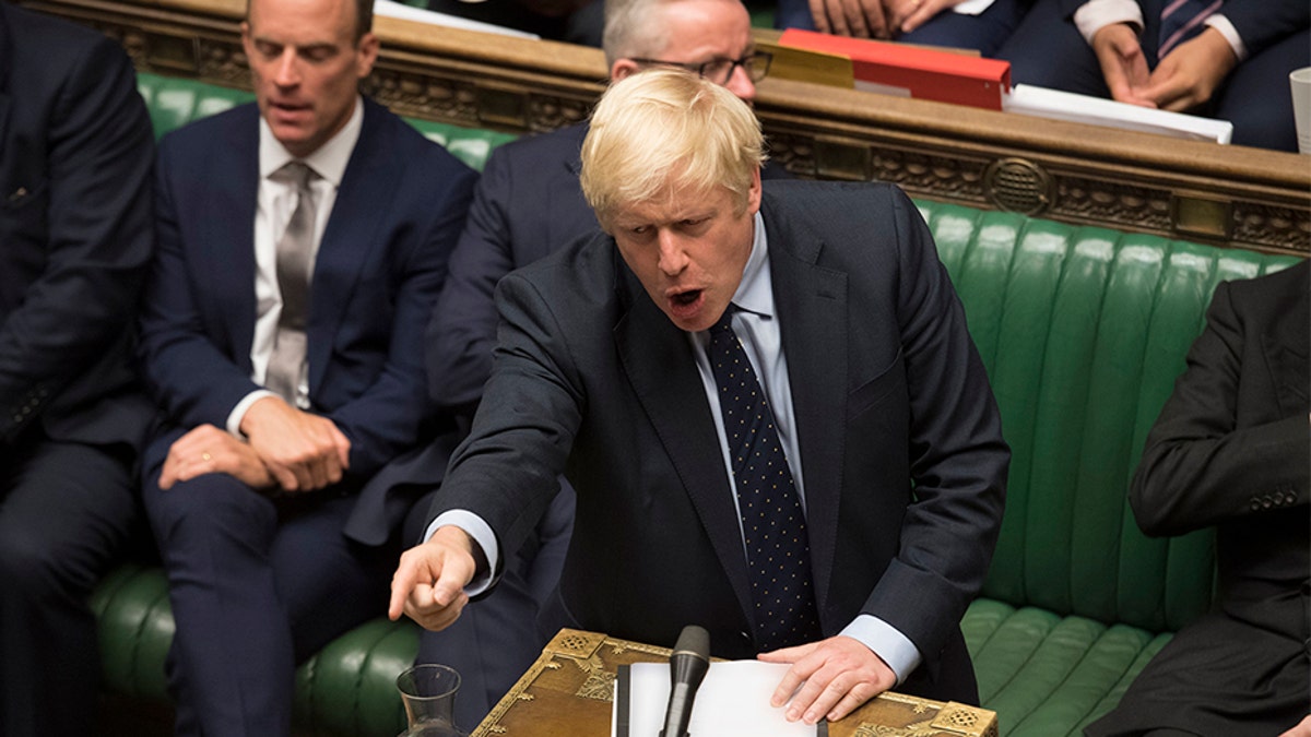 Britain's Prime Minister Boris Johnson speaks in the House of Commons in London after MPs voted in favor of allowing a cross-party alliance to take control of the Commons agenda on Wednesday in a bid to block a no-deal Brexit on Oct. 31.