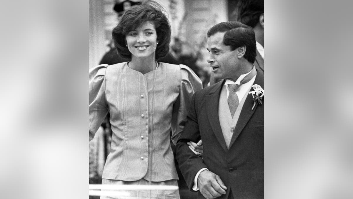 In this April 26, 1986, file photo, maid of Honor Caroline Kennedy and Best Man Franco Columbu leave St. Francis Xavier Church after the wedding of Caroline's cousin Maria Shriver to Arnold Schwarzenegger in Hyannis, Mass. Italian bodybuilder, boxer and actor Franco Columbu, one of Arnold Schwarzenegger's closest friends, has died aged 78. Columbu died in a hospital in his native Sardinia on Friday, Aug. 30, 2019 afternoon after being taken ill while he was swimming in the sea.