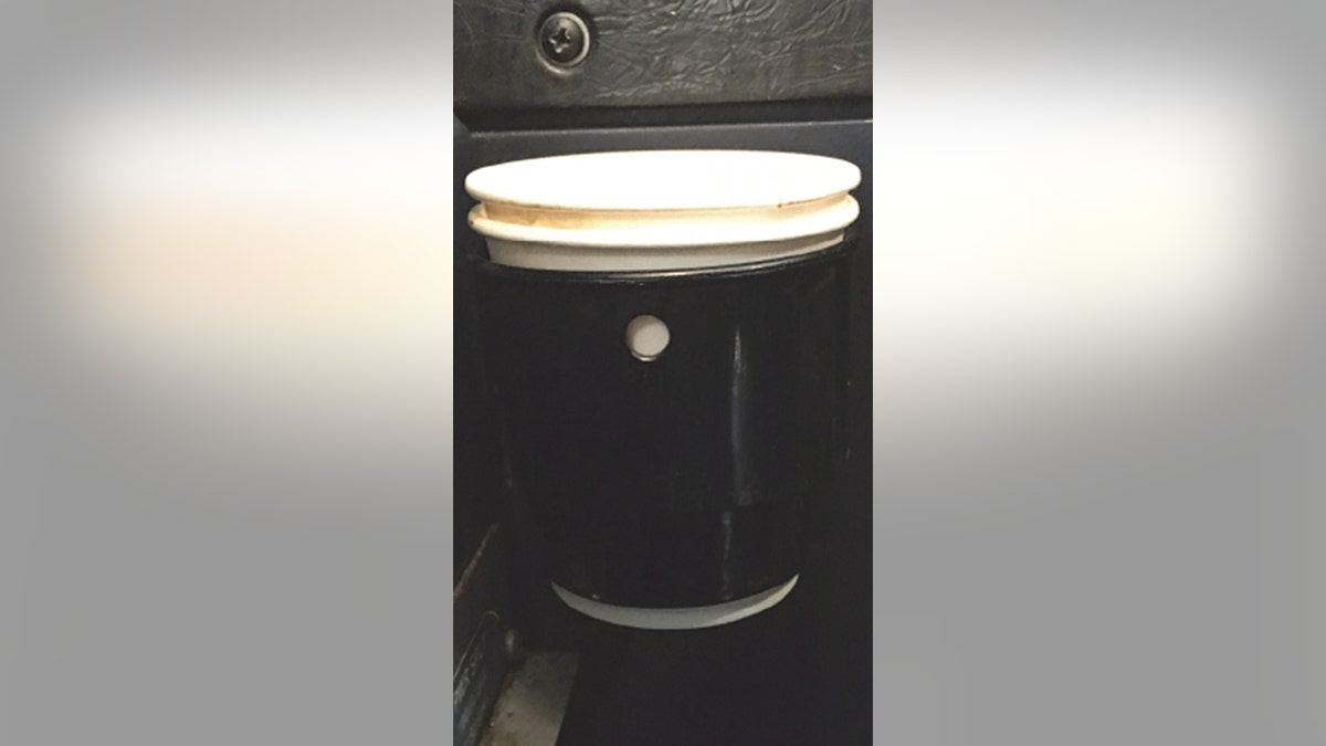 An image of the coffee, pictured here in a cupholder, that spilled and caused the plane to land early. 