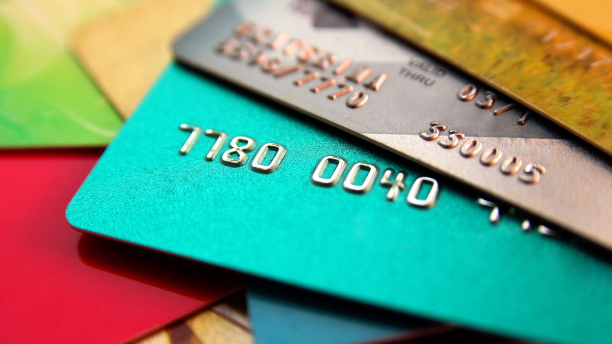 stack of multicolored credit cards, close up view with selective focus