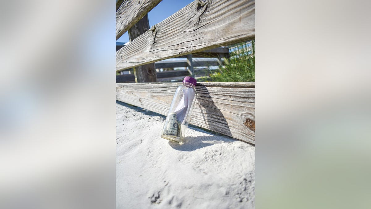 The bottle, which was cast into the waters on Aug. 1 from Destin, Fla., held notes, a small bag containing human ashes and four $1 bills.