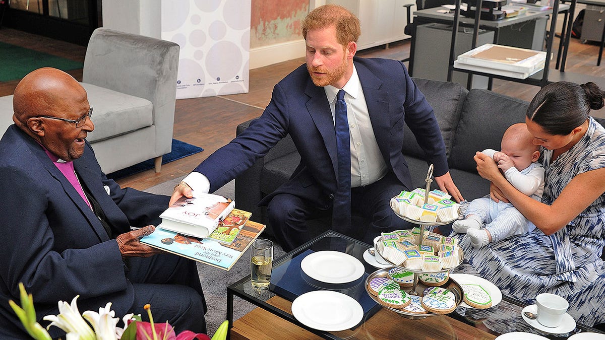 Britain's Duke and Duchess of Sussex, Prince Harry and his wife Meghan hold their baby son Archie as they meet with Archbishop Desmond Tutu.