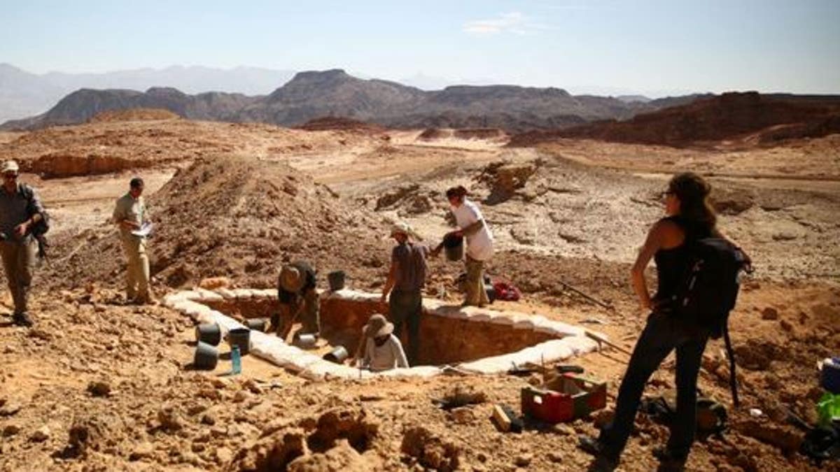 Archaeologists excavate a copper production site dubbed "Slaves' Hill" in the Timna Valley, Israel.