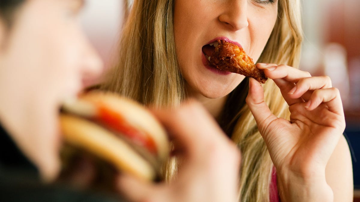 A couple eating fast food in a restaurant