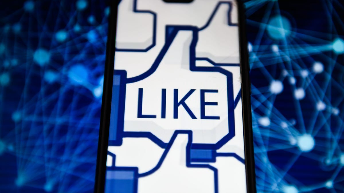 The Facebook like logo is seen displayed on an Android mobile phone. The tech giant is experimenting with hiding likes in Australia.