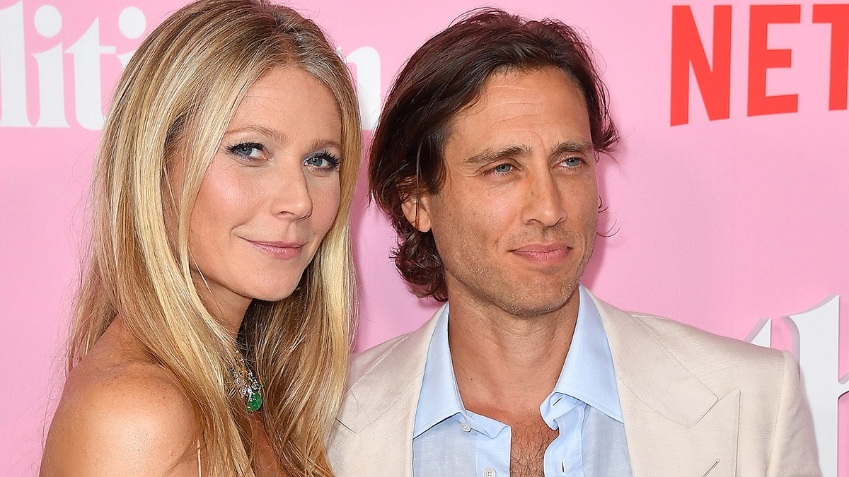 Gwyneth Paltrow and her husband Brad Falchuk arrive for the Netflix premiere of 