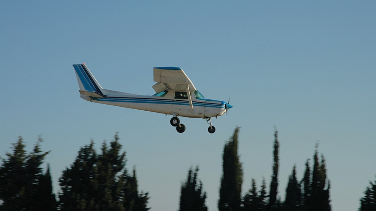 A Cessna 152 lowers toward the ground. Max Sylvester was forced to make an emergency landing on Saturday afternoon after his flight instructor, Robert Mollard blacked out mid-flight.