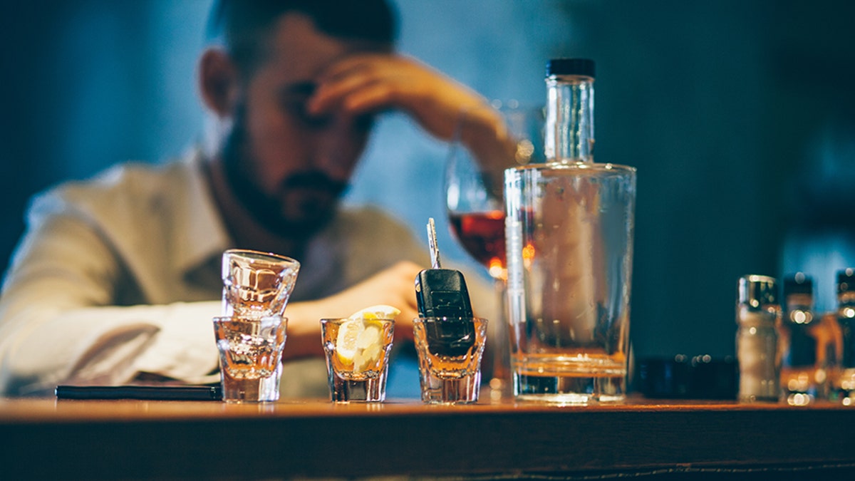 man drinking alone