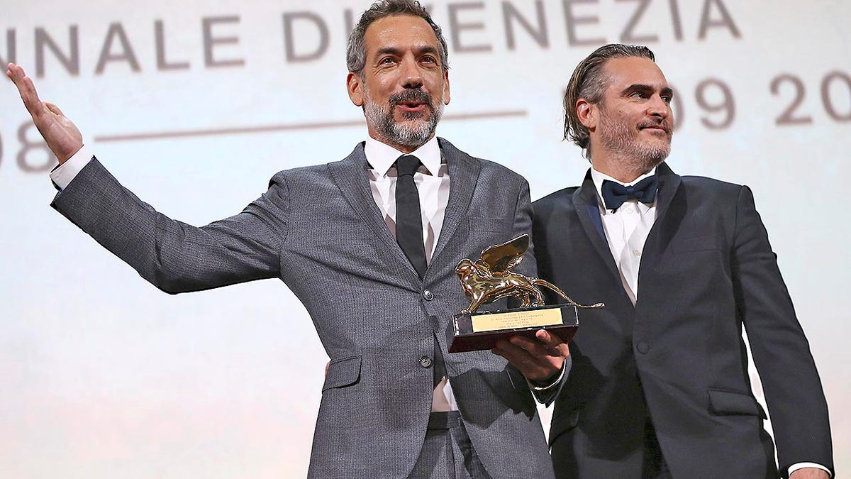 Director Todd Phillips, left, holds the Golden Lion for Best Film for 'Joker', joined by lead actor Joaquin Phoenix at the closing ceremony of the 76th edition of the Venice Film Festival, Venice, Italy, Saturday, Sept. 7, 2019. (Photo by Joel C Ryan/Invision/AP)