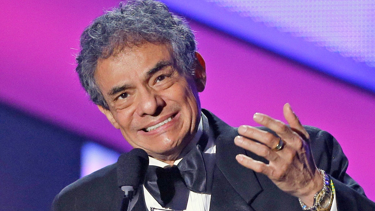 FILE - In this April 25, 2013 file photo, Jose Jose receives the Billboard Lifetime Achievement Award at the Latin Billboard Awards in Coral Gables, Fla. Local media outlets report that the Mexican crooner died Saturday, Sept. 28, 2019 from pancreatic cancer. He was 71. (AP Photo/Alan Diaz, File)