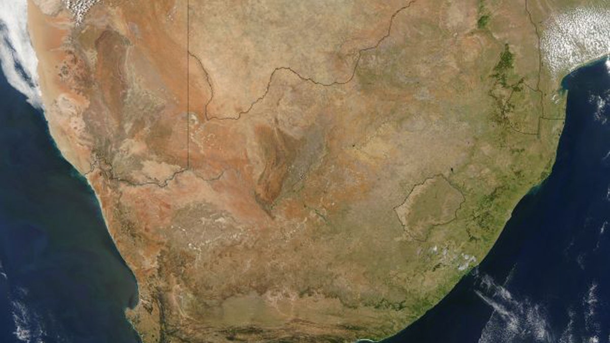 A satellite image of the southern tip of Africa taken Oct. 31, 2004 by the Moderate Resolution Imaging Spectroradiometer (MODIS) on NASA’s Aqua satellite. The Karoo magma province, which is partly in Mozambique (upper right) reveal that a magma plume poked a hole through Earth 180 million years ago, when the entire region was part of the supercontinent known as Pangea. (Credit: Jacques Descloitres, MODIS Rapid Response Team, NASA/GSFC)