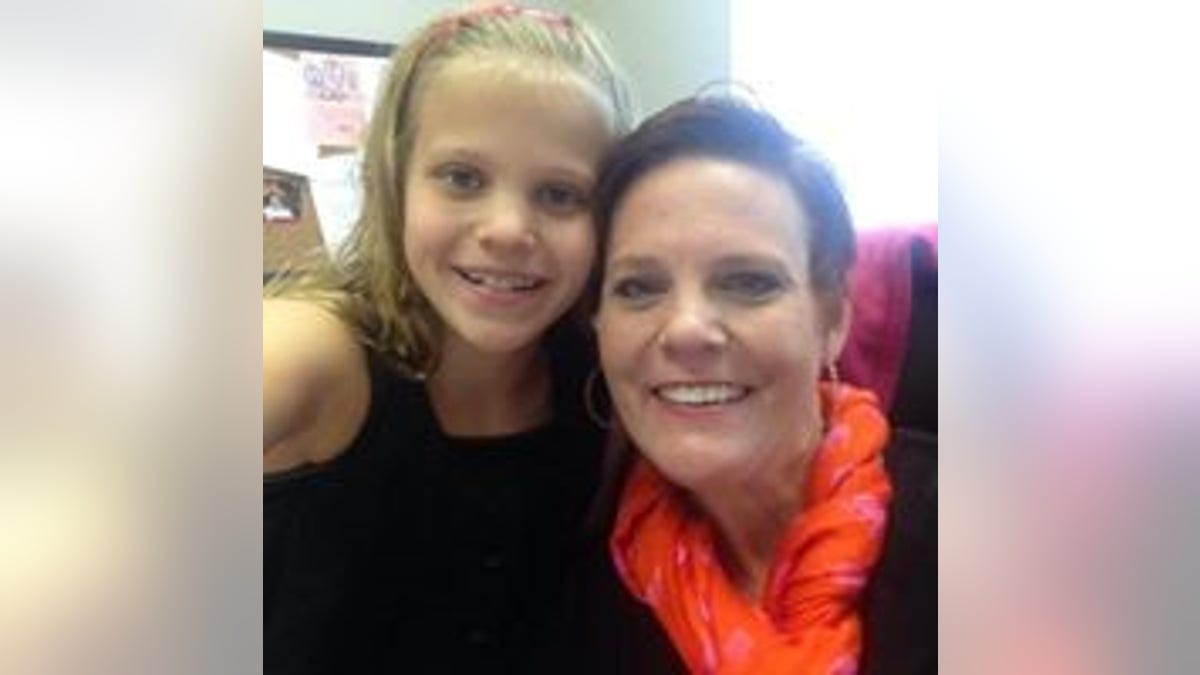 Mallory, pictured with her mother Dianne, had quit cheerleading and her grades began slipping when the online torment began, her family said.