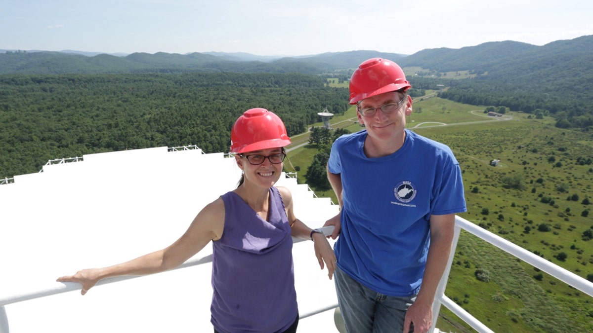 WVU's Maura McLaughlin and Duncan Lorimer use the Green Bank Observatory for research. Here, McLaughlin and Lorimer are standing on top the Green Bank Telescope, which they used to help detect the most massive neutron star ever. (CREDIT: Scott Lituchy/West Virginia University.)