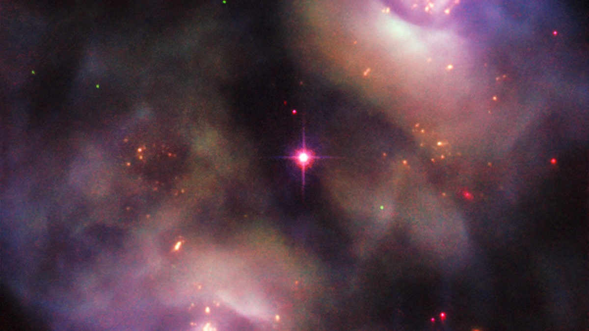 This image, taken with the NASA/ESA Hubble Space Telescope, shows a dark, gloomy scene in the constellation of Gemini. It confused astronomers when it was first studied. Instead of being classified as a single object, it was recorded as two objects, owing to its symmetrical lobed structure (known as NGC 2371 and NGC 2372, though sometimes referred to together as NGC 2371/2). (Credit: ESA/Hubble & NASA, R. Wade et al.