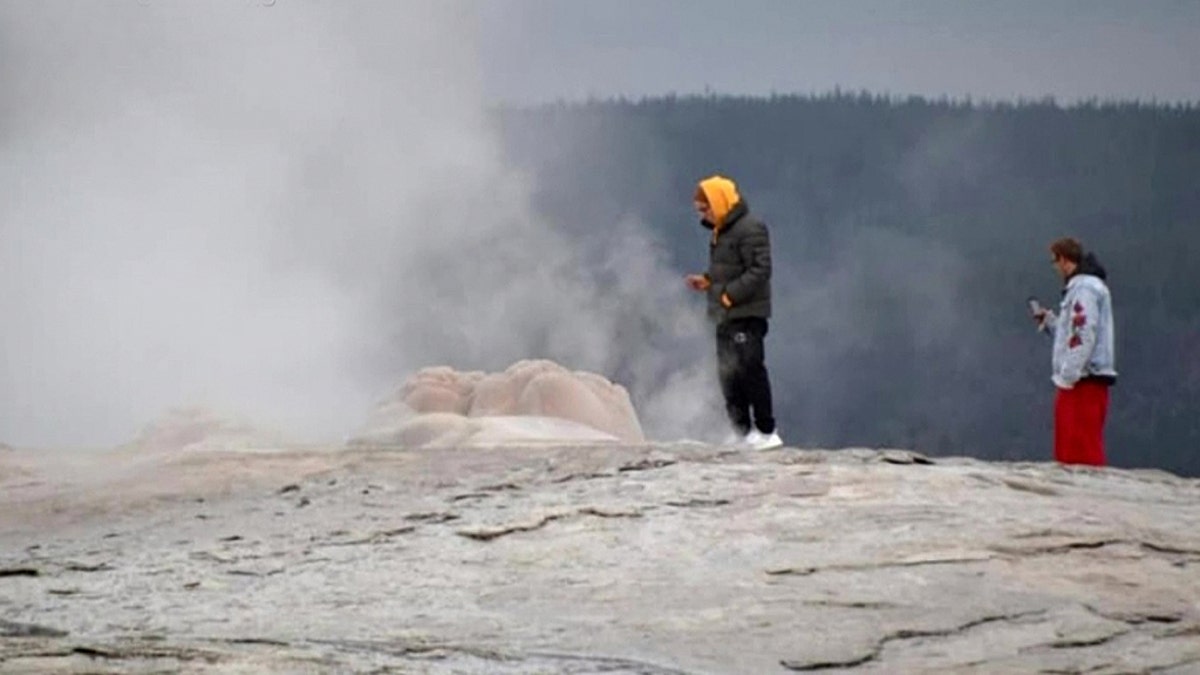 On Sept. 10, two men were caught walking “dangerously close” to the spout of the legendary geyser and taking photos on their cellphones, as seen pictured here.