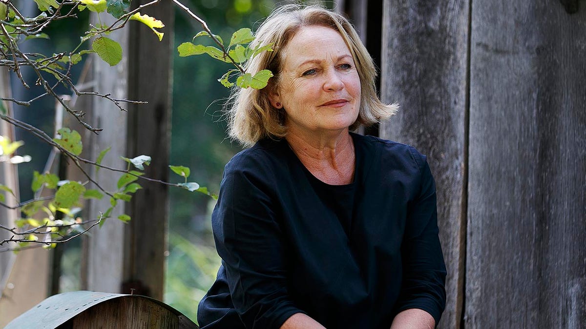 In this Friday, July 12, 2019 file photo, retired opera singer Patricia Wulf poses for a portrait at her home in Virginia. Wulf told the AP that Placido Domingo would confront her night after night when they performed together with the same whispered question, uttered very close to her face: “‘Patricia, do you have to go home tonight?’” (AP Photo/Jacquelyn Martin)