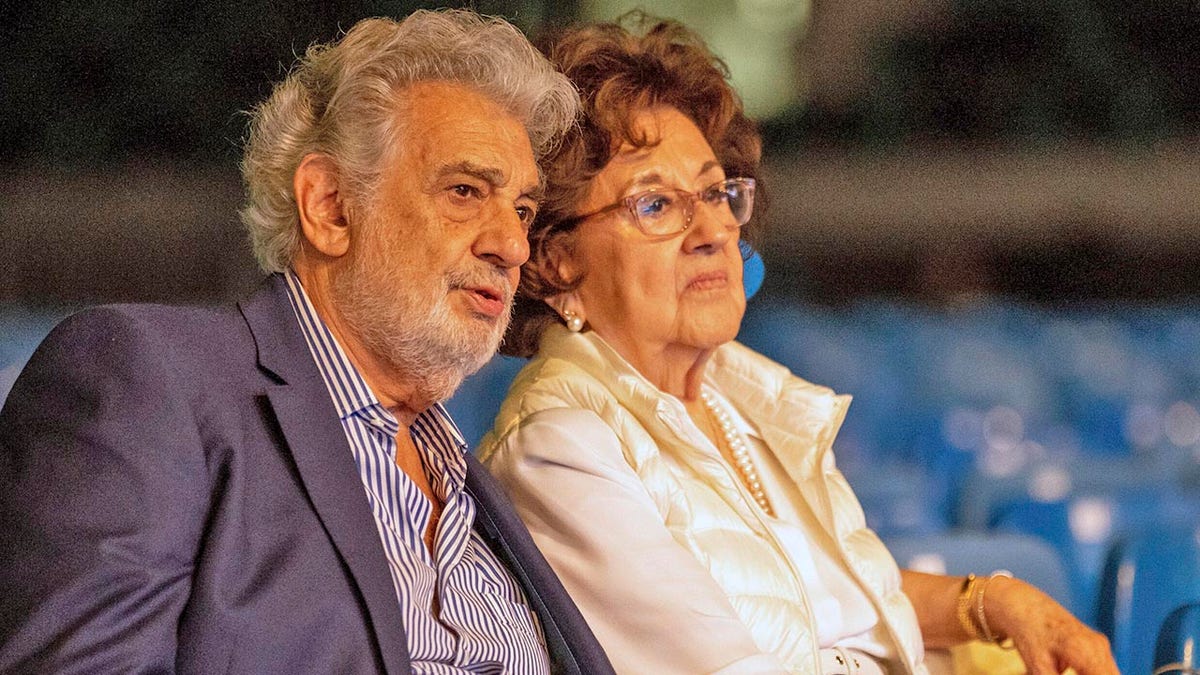 FILE - In this Tuesday, Aug. 27, 2019 file photo, Placido Domingo and his wife, Marta, attend a rehearsal for the opening gala of the Gerard of Sagredo Youth Forum and Sports Center in Szeged, Hungary, a day prior to the event. Melinda McLain, who was the production coordinator at LA Opera for its inaugural season in 1986-87 and also worked at the Houston Grand Opera, said she and others would invite Marta to attend company parties “because if Marta was around, he behaves.” (Tibor Rosta/MTI via AP)
