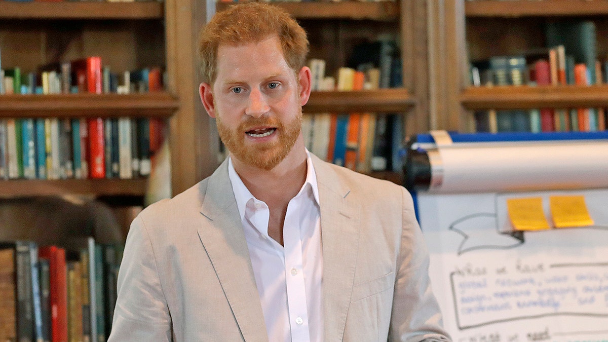 FILE - In this July 23, 2019 file photo, Britain's Prince Harry delivers a speech as he attends Dr Jane Goodall's Roots &amp; Shoots Global Leadership Meeting at St. George's House, Windsor Castle in England. The eco-minded Prince Harry announces a massive travel sustainability initiative in partnership with key service providers that’s aimed at bettering the practices of the global industry amid an ever-increasing number of travelers. The Duke of Sussex announced Travalyst at a news conference Tuesday, Sept. 3, in Amsterdam, a city hit hard by over-tourism. He was joined by his partners, including Visa, TripAdvisor and Booking.com.(AP Photo/Kirsty Wigglesworth, Pool)