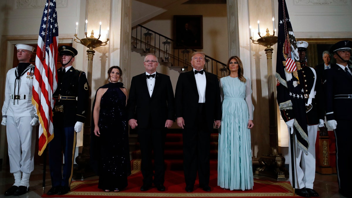 President Donald Trump and first lady Melania Trump stand with Australian Prime Minister Scott Morrison and his wife Jenny Morrison in the Grand Foyer of the White House. (AP Photo/Alex Brandon)