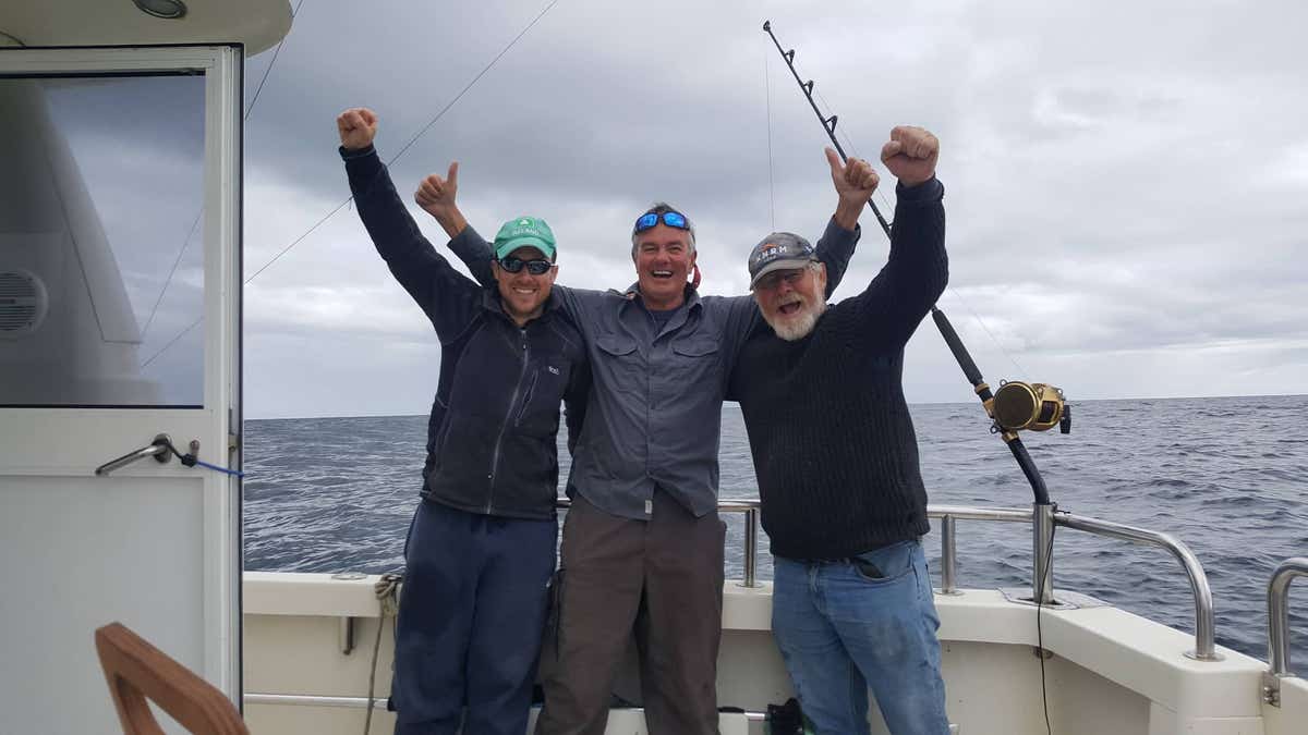 Darren O'Sullivan (left), David Edwards (center) and Henk Veldman (right) were able to catch, tag and release the first-ever bluefin tuna in waters off the south coast of Ireland. 