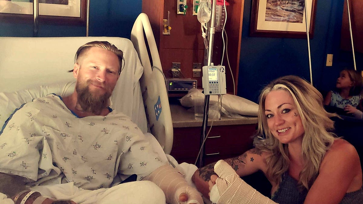 The bride and groom in the hospital following their serious motorcycle crash.