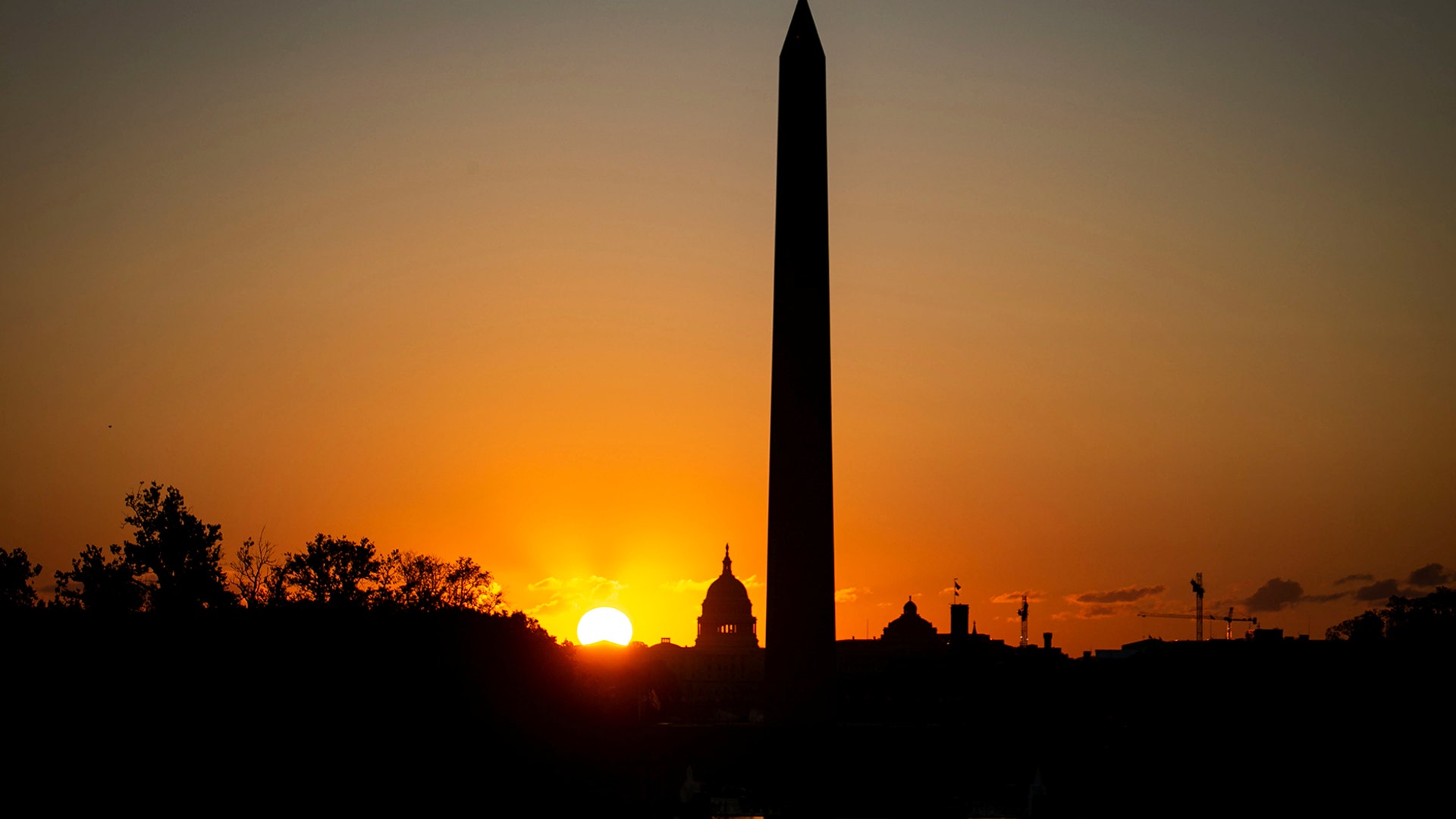 The U.S. Capitol and the Washington Monument are seen at sunrise on the National Mall before the iconic landmark is set to reopen to visitors after more than three years of construction and repairs in Washington, Sept. 19, 2019.
