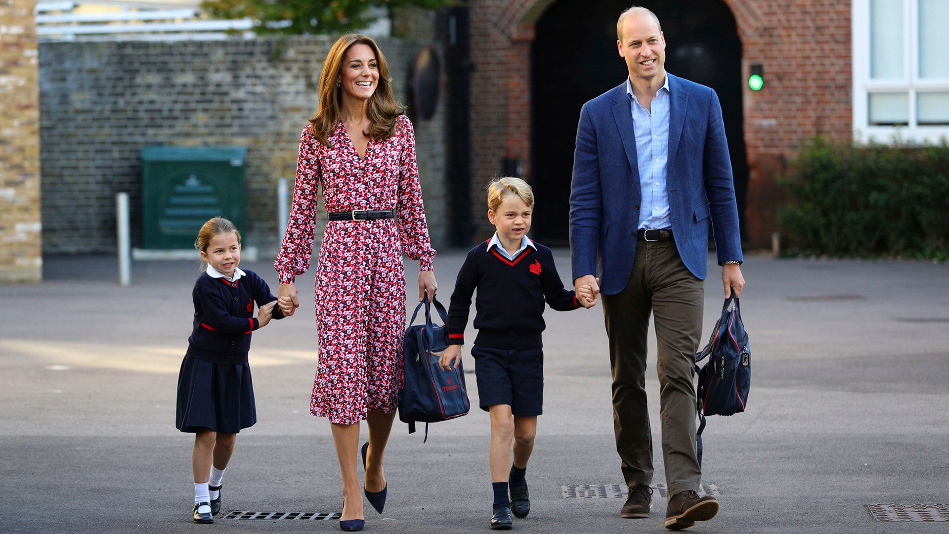 Britain's Princess Charlotte with her brother Prince George and their parents Prince William and Kate, Duchess of Cambridge, arrives for her first day of school at Thomas's Battersea in London, Sept. 5, 2019. 