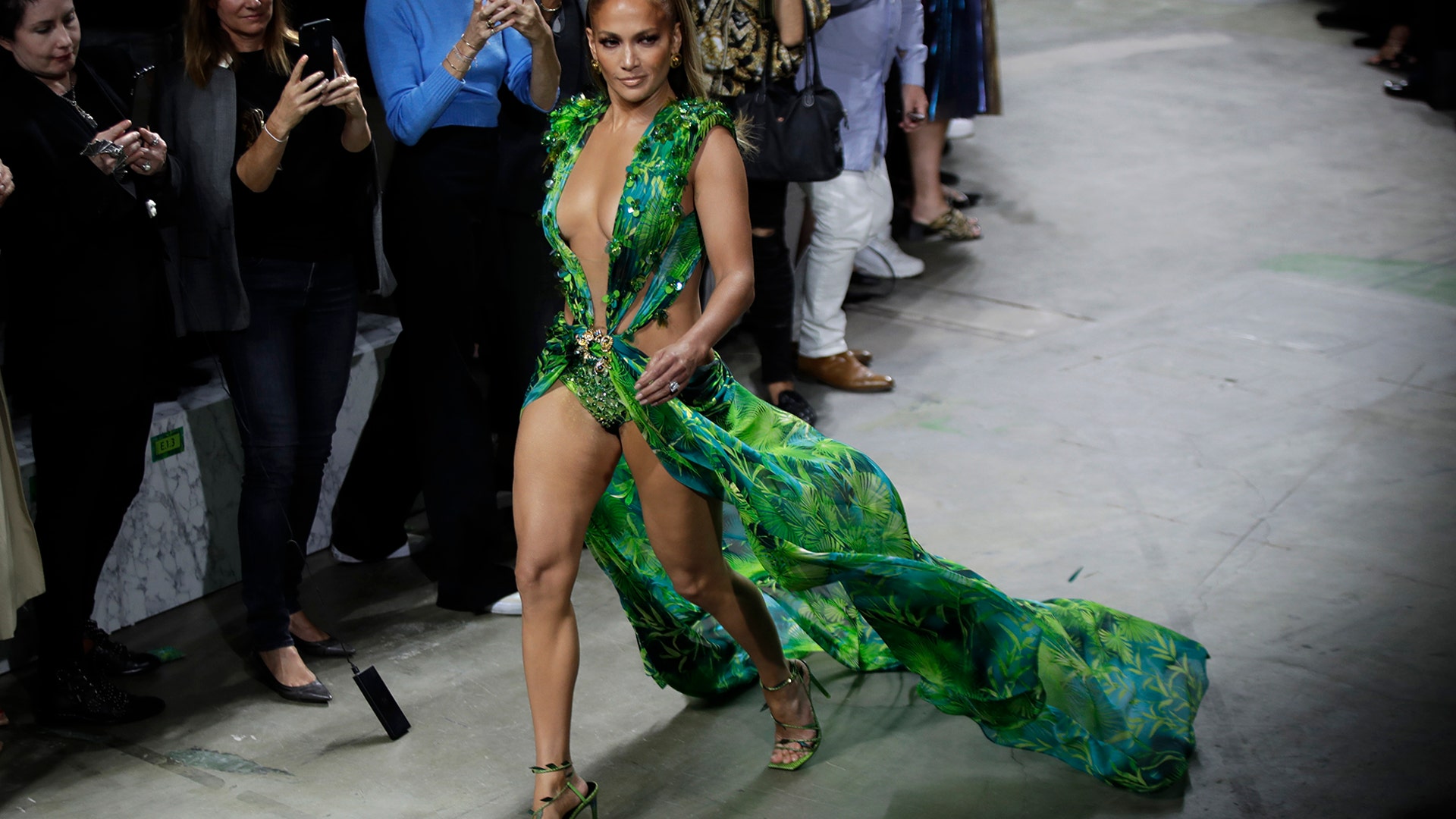Actress Jennifer Lopez wears a creation as part of the Versace Spring-Summer 2020 collection, unveiled during the fashion week, in Milan, Italy, Sept. 20, 2019. 
