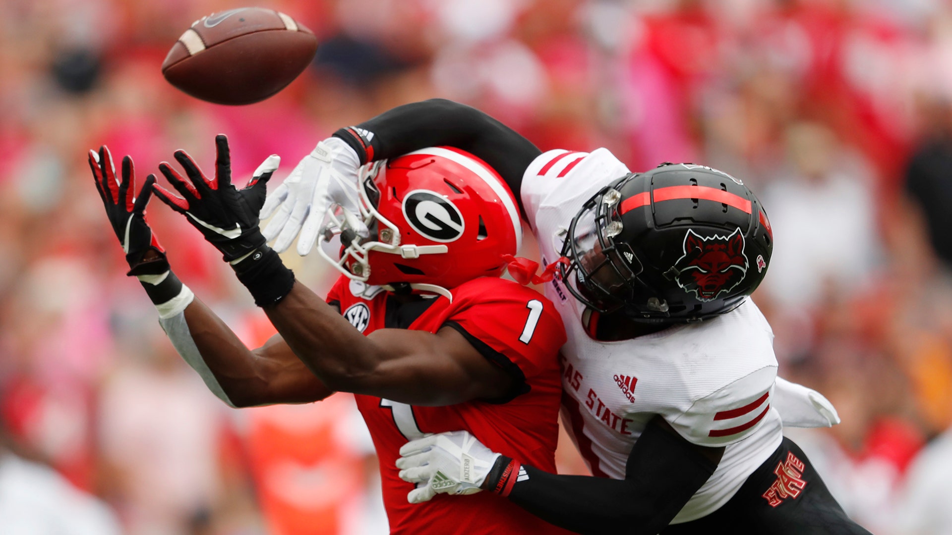 Arkansas State cornerback Jerry Jacobs breaks up a pass intended for Georgia wide receiver George Pickens in the first half of an NCAA college football game in Athens, Georgia, Sept. 14, 2019.