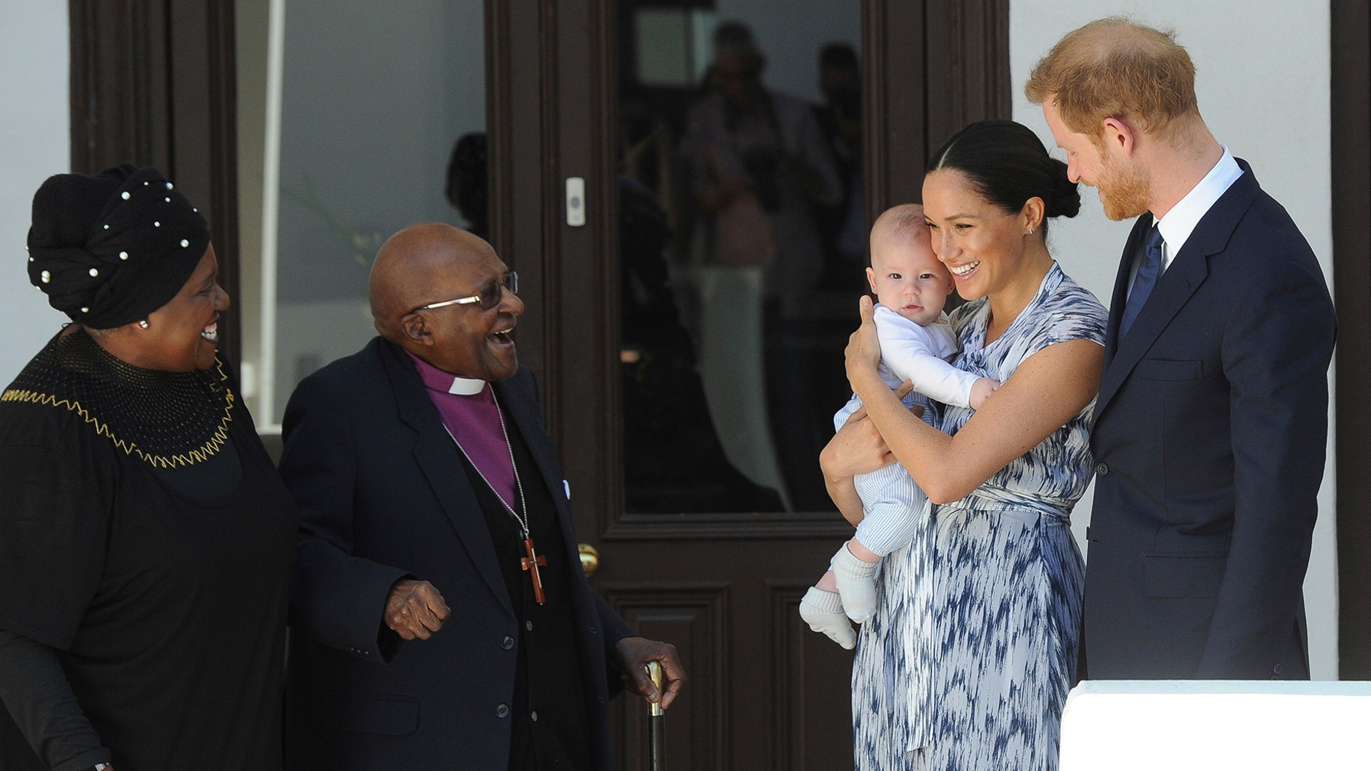 Britain's Prince Harry and Meghan, Duchess of Sussex, hold their son Archie as they meet Anglican Archbishop Emeritus, Desmond Tutu and his wife Leah in Cape Town, South Africa, Sept. 25, 2019. 