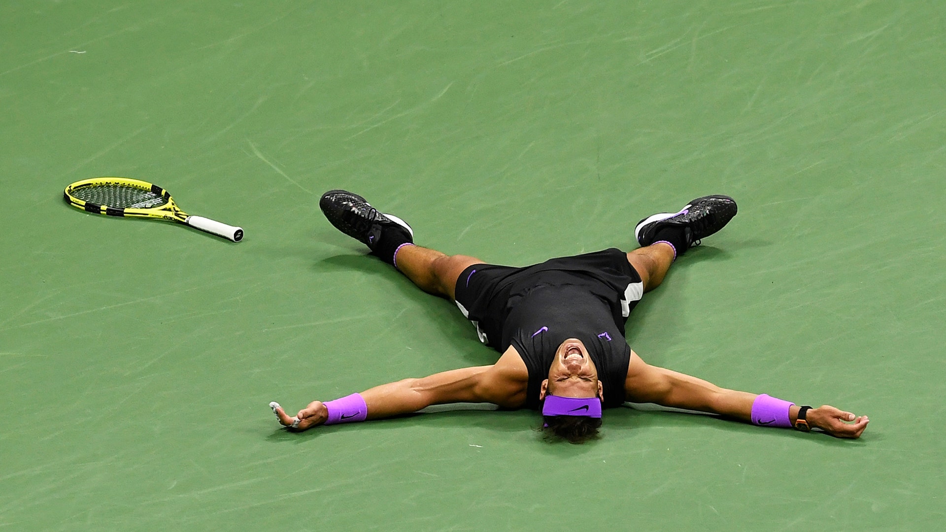 Rafael Nadal, of Spain, lays on the court after defeating Daniil Medvedev to win the men's singles final at the U.S. Open tennis championships in New York, Sept. 8, 2019. 