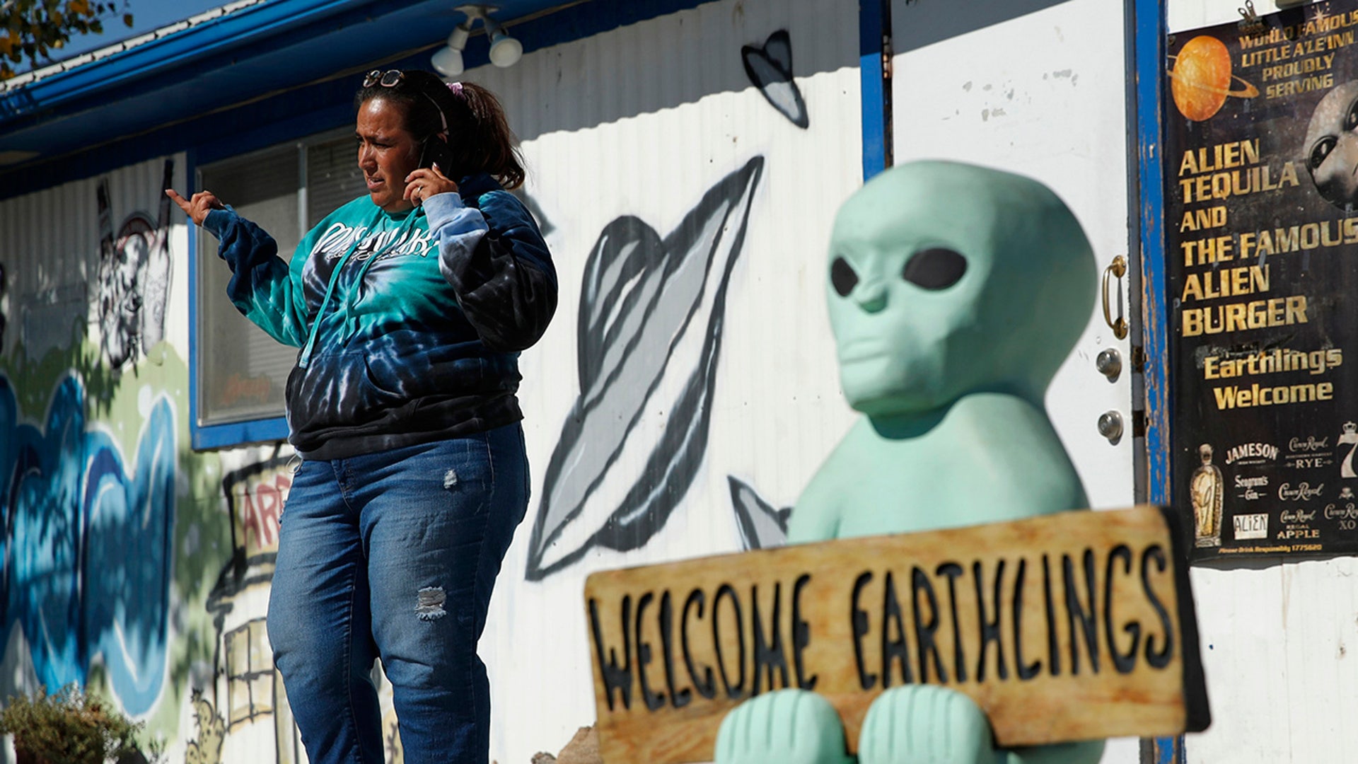 Little A'Le'Inn owner Connie West speaks on the phone outside of the bar and restaurant, Wednesday, Sept. 18, 2019, in Rachel, Nev. West was preparing for an event spawned from the "Storm Area 51" internet hoax. (AP Photo/John Locher)
