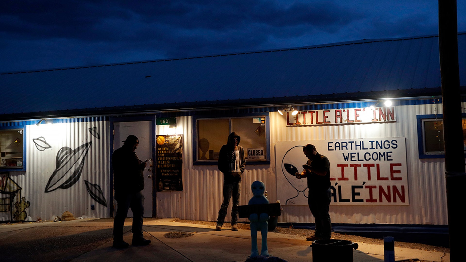 People stand around the Little A'Le'Inn during an event inspired by the "Storm Area 51" internet hoax, . (AP Photo/John Locher)
