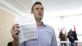 Russia carries out mass raids against supporters of opposition leader Navalny